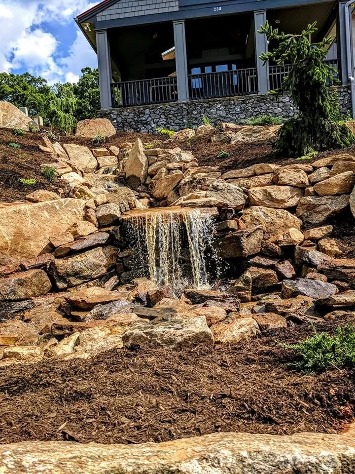 Pondless waterfall cascading water feature