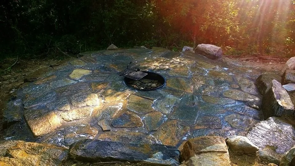 flagstone patio with a built in fire pit