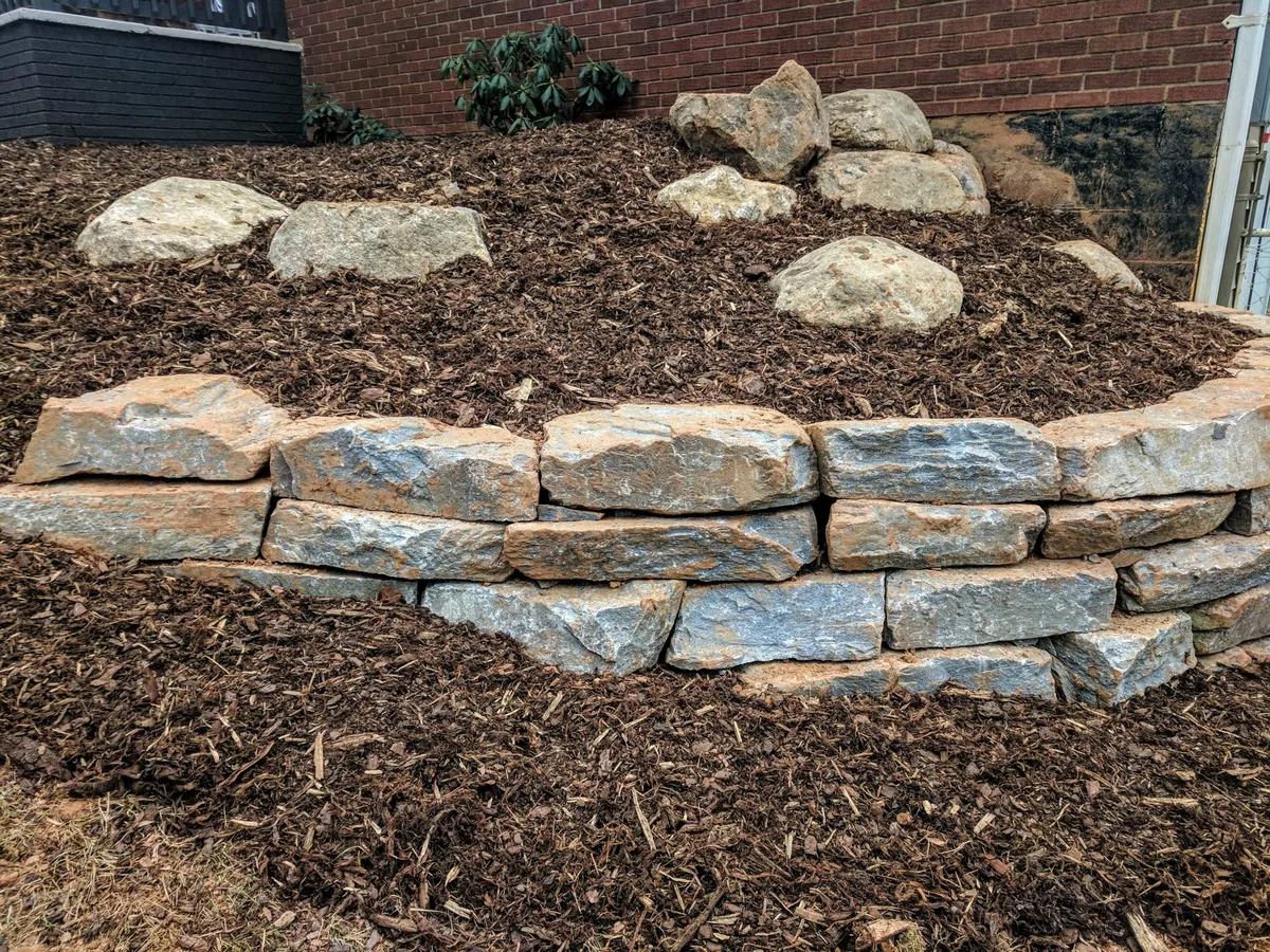 stone retaining walls surround raised bed scaled 1